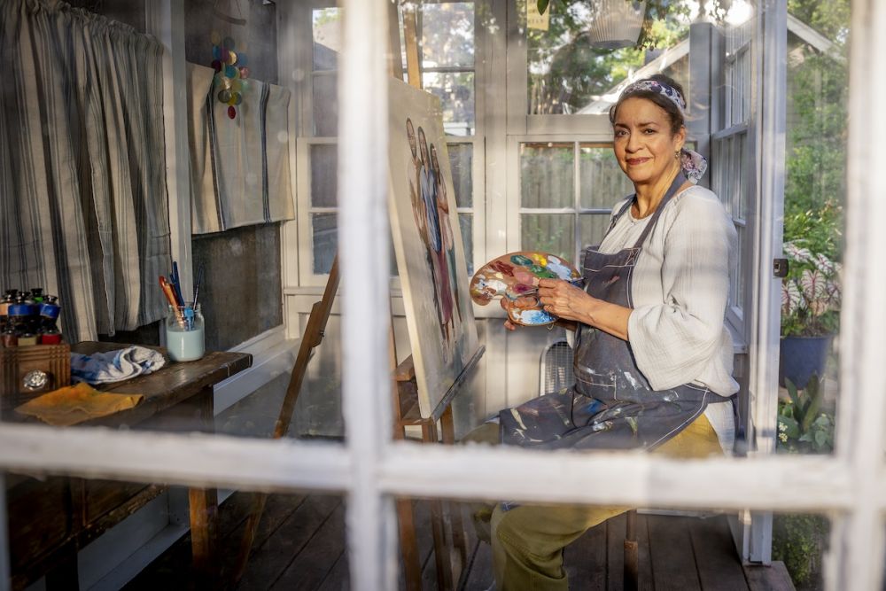 woman painter in window