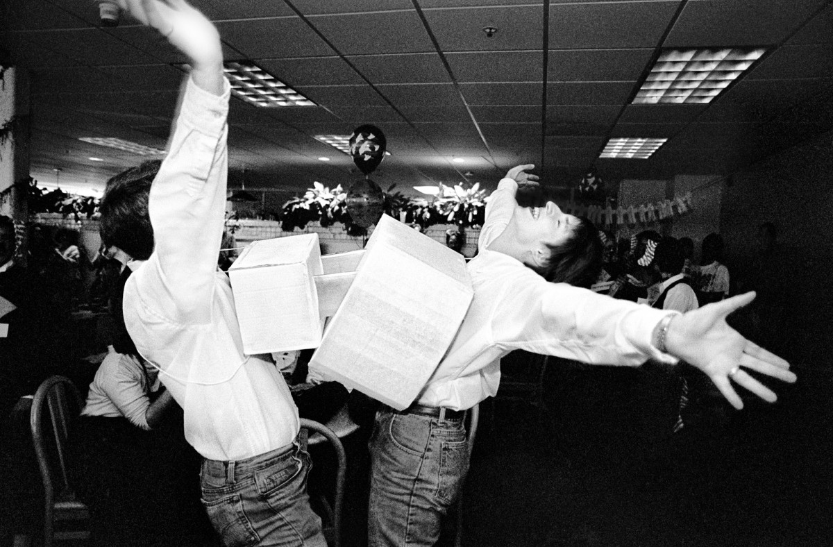 Geek Sex. Adobe Systems, Mountain View, California, 1991. Real-life boyfriend and girlfriend act out a rudimentary electrical metaphor for sex at an Adobe Halloween party. Technology workers were notoriously socially inept and often shy, especially male engineers. Fantasy games and role-playing were very popular, and any opportunity to dress in costumes was welcomed. It was a lot like high school. This couple repeated the ritual all over the company to the delight of fellow workers. 
